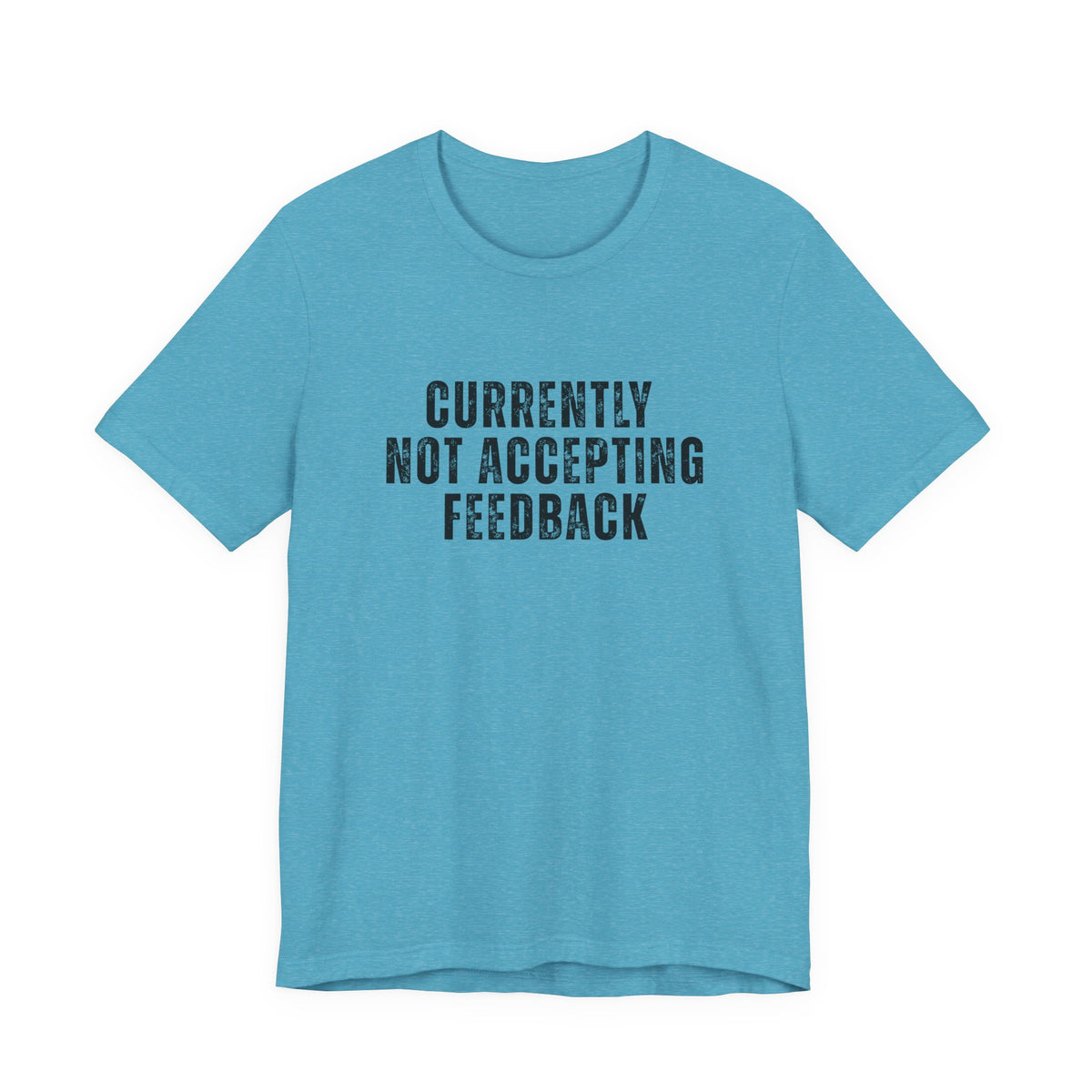 A light blue heather crewneck t-shirt with the text 'CURRENTLY NOT ACCEPTING FEEDBACK' printed in a distressed black font on the chest, displayed against a solid white background.